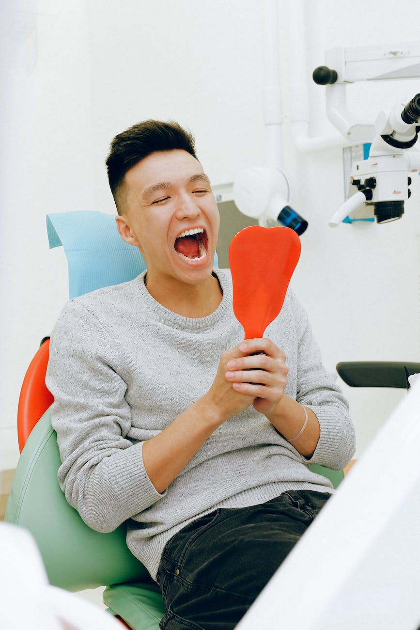man checking his teeth